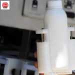 Three-nozzle rotary filler and capper